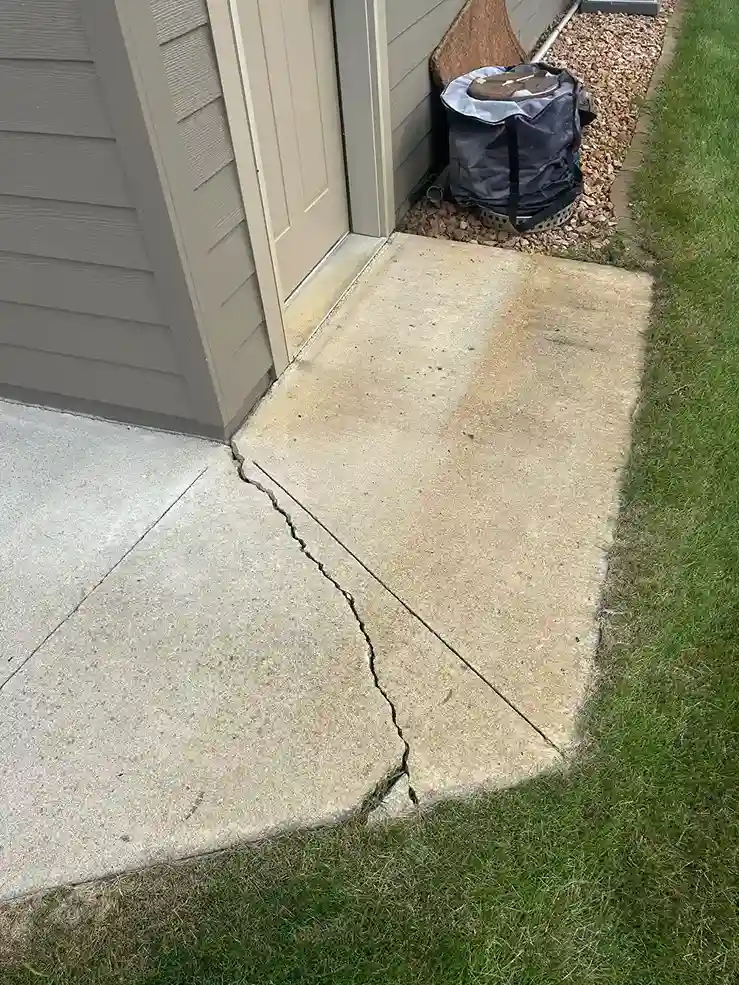 High pressure concrete cleaning restoring bright original slab color