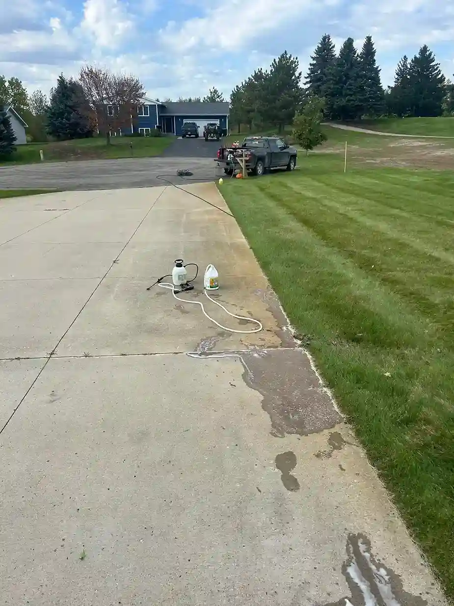 Stone patio and paver power wash restoration removing weed and moss buildup
