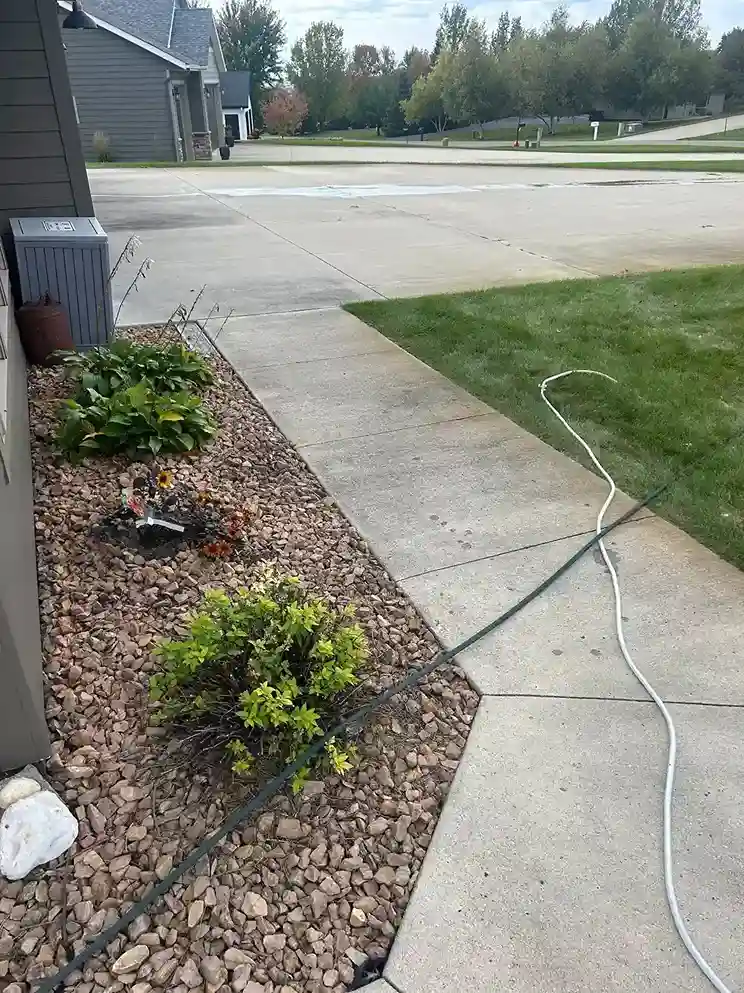 Professional rotary surface cleaner cleaning concrete flatwork evenly in Morris MN