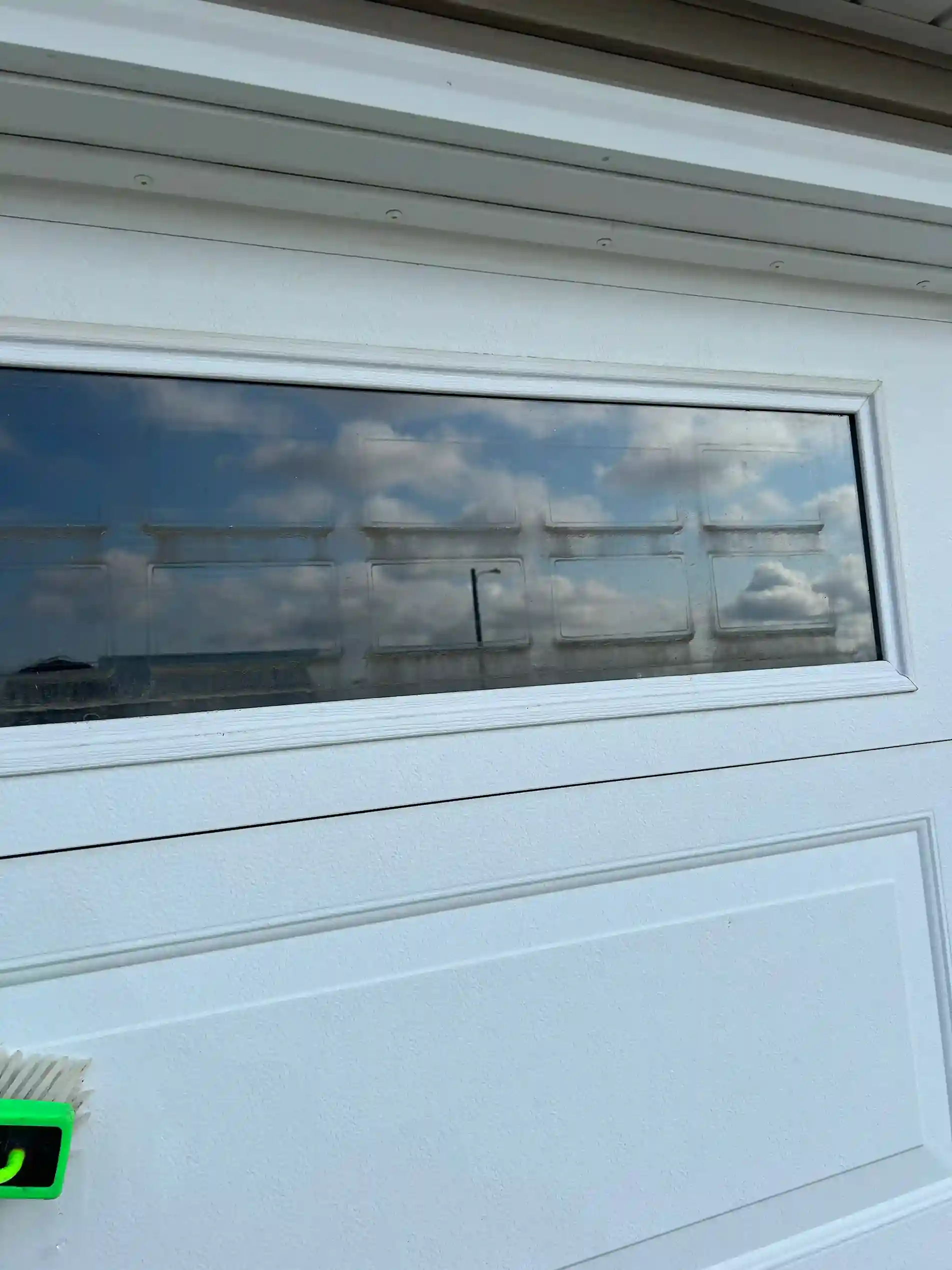 Hand squeegee window detailing with spotless glass edges in Morris MN