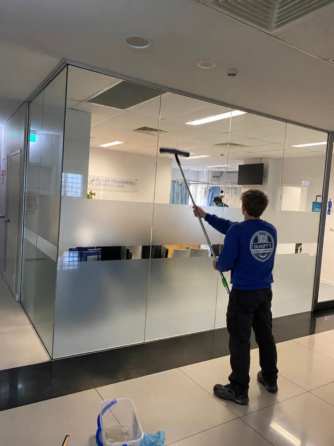 Hand squeegee interior window washing and sill detailing in Morris MN